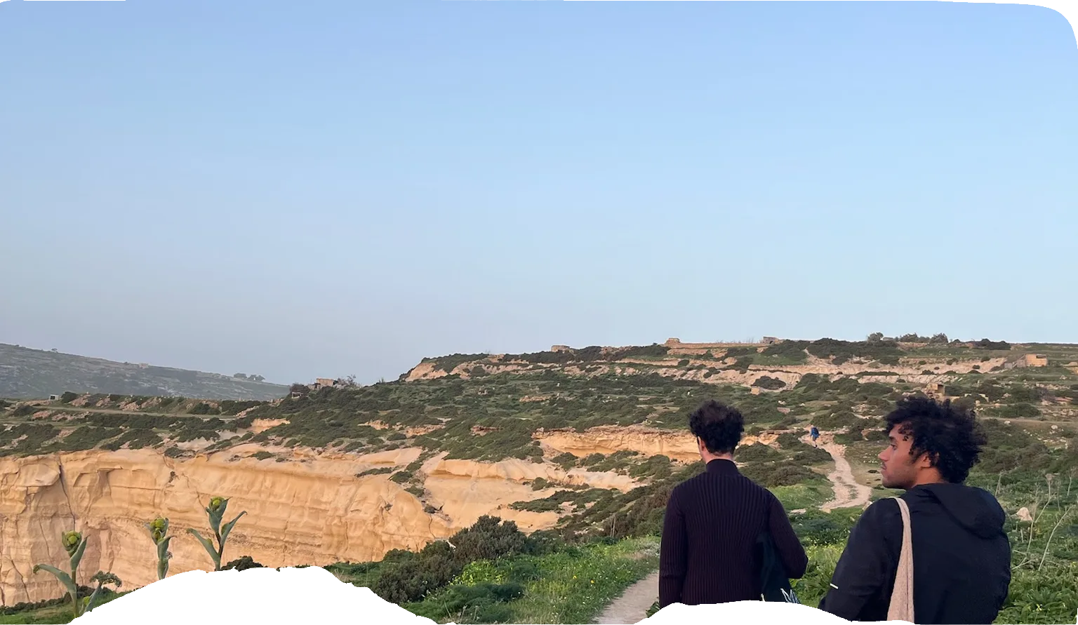 Two friends walking on a nature path